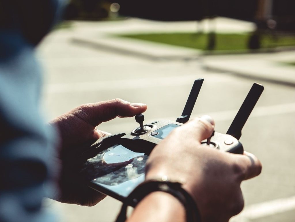 Man using a remote control for a drone